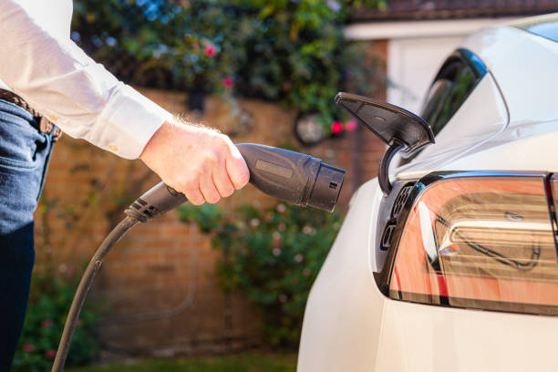 Electrician installing EV charger at Morgan Hill residential property
