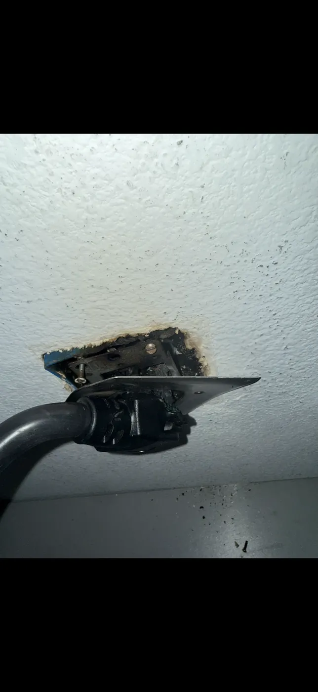 Damaged EV charging receptacle removed during EV charger replacement