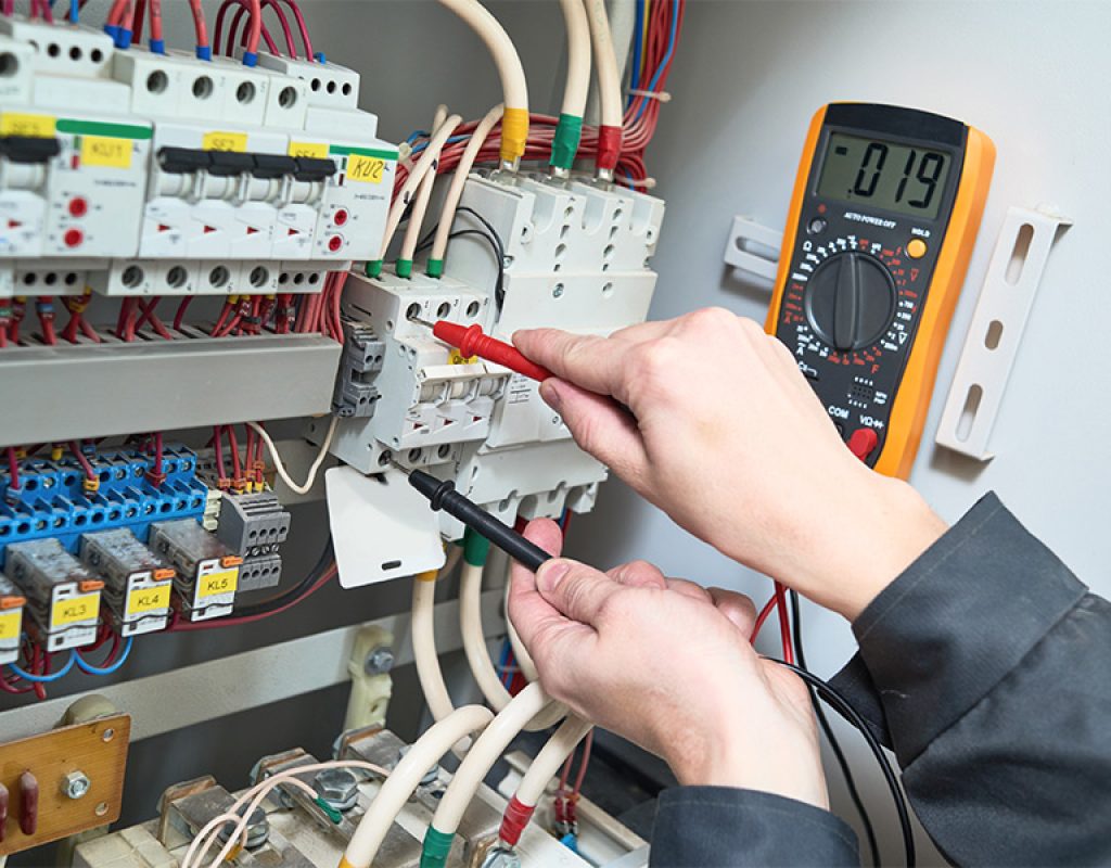 BNV Electric Inc electrician inspecting an electrical panel during an emergency service call in Morgan Hill, California.