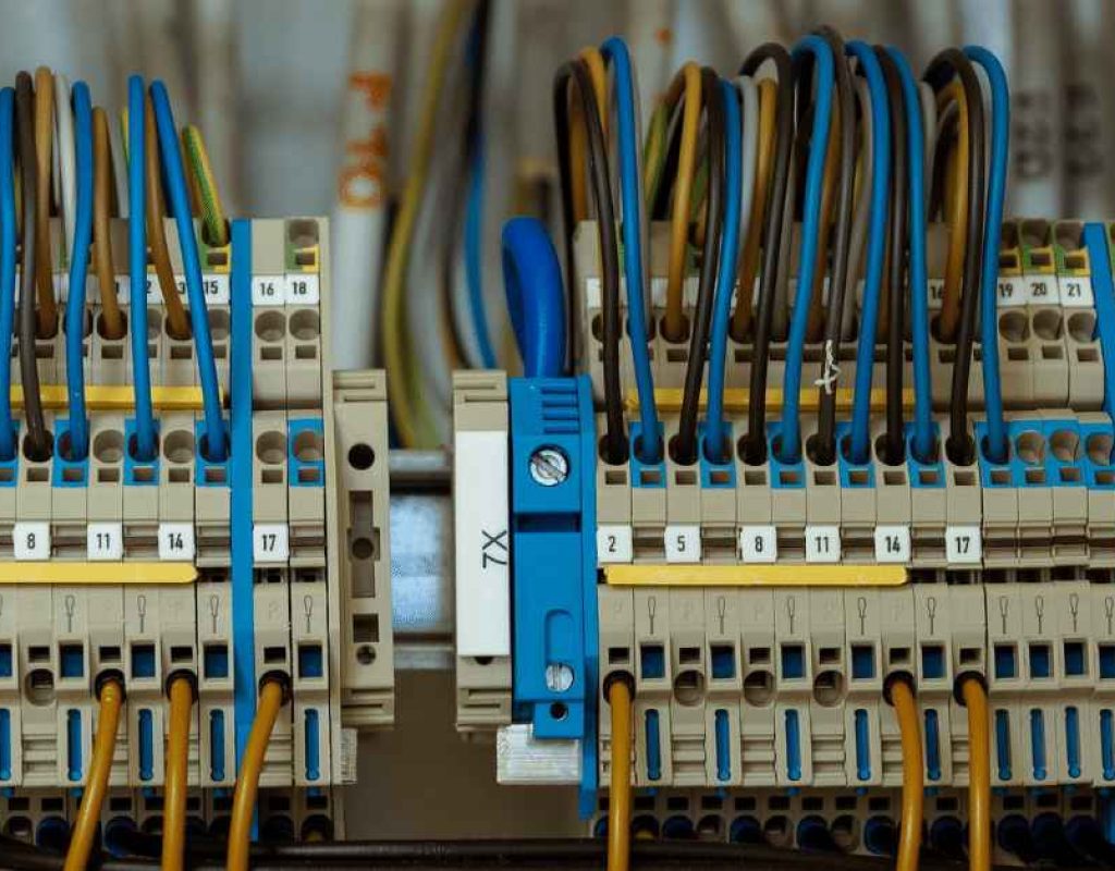 Electrical contractor troubleshooting system issues using advanced diagnostic tools correctly.