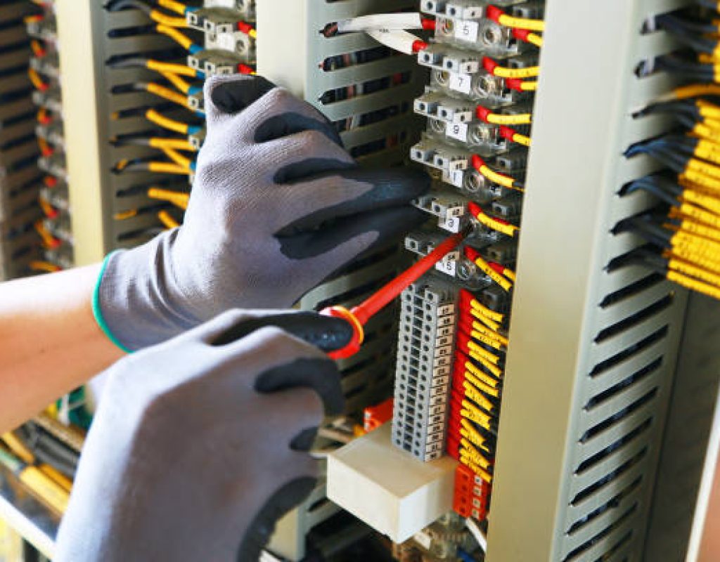 Electrician working on residential electrical panel wiring in Morgan Hill, CA