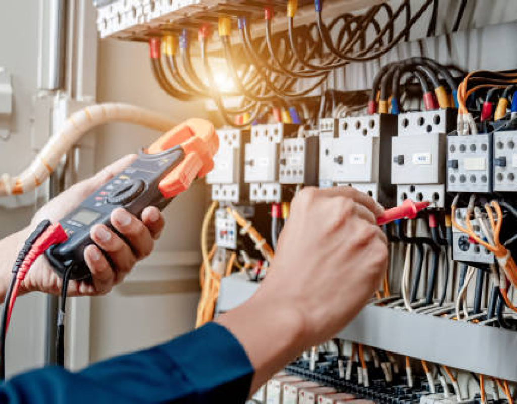 Electrical Panel Replacement in Santa Clara, CA in progress as an electrician tests newly installed breakers