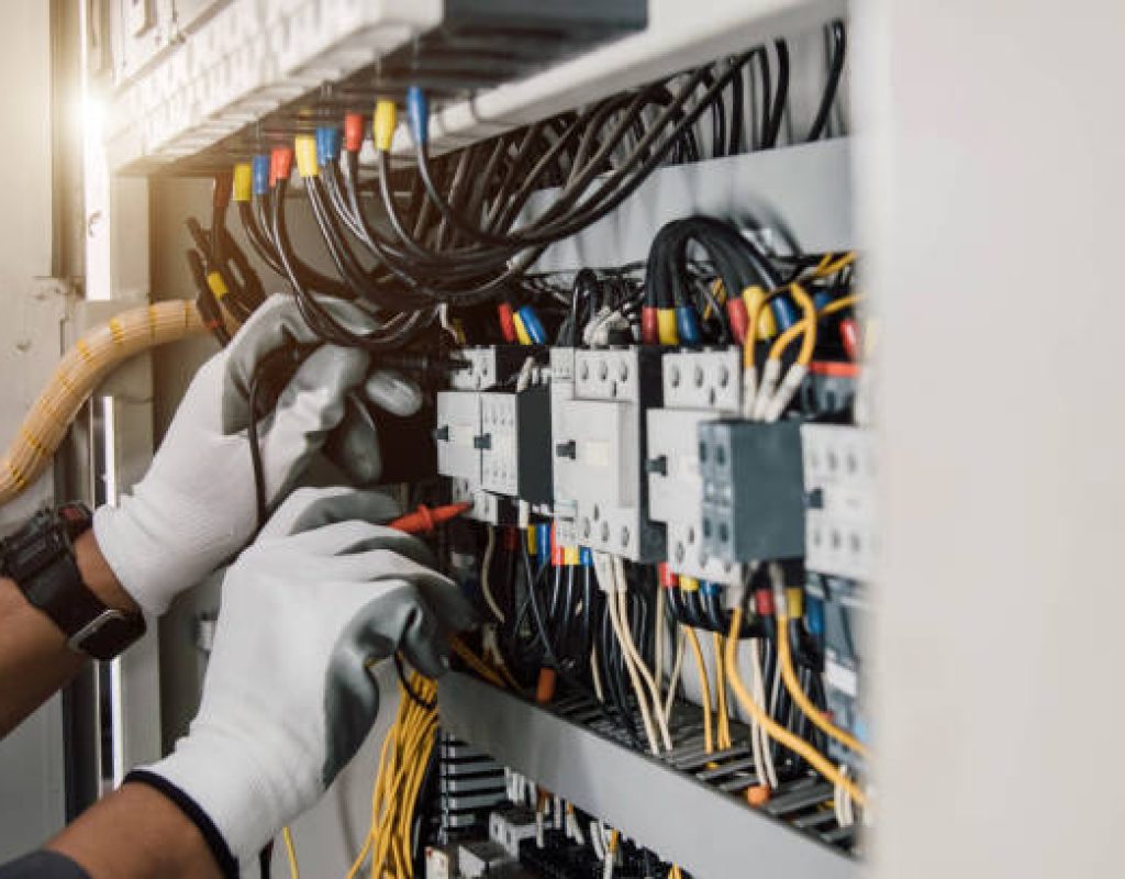 Electrician performing Electrical Panel Replacement inside a San Jose, CA home while checking labeled circuits