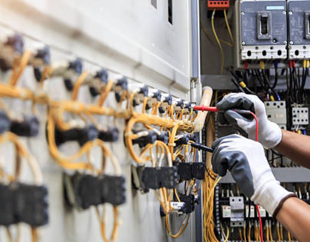 BNV Electric Inc technician performing commercial wiring in office building space